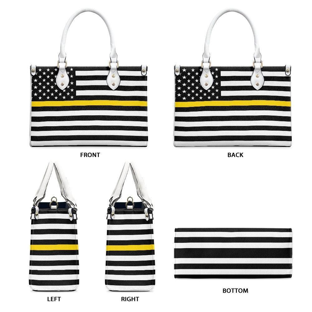 [Brand] handbag with American flag and yellow stripe design.
