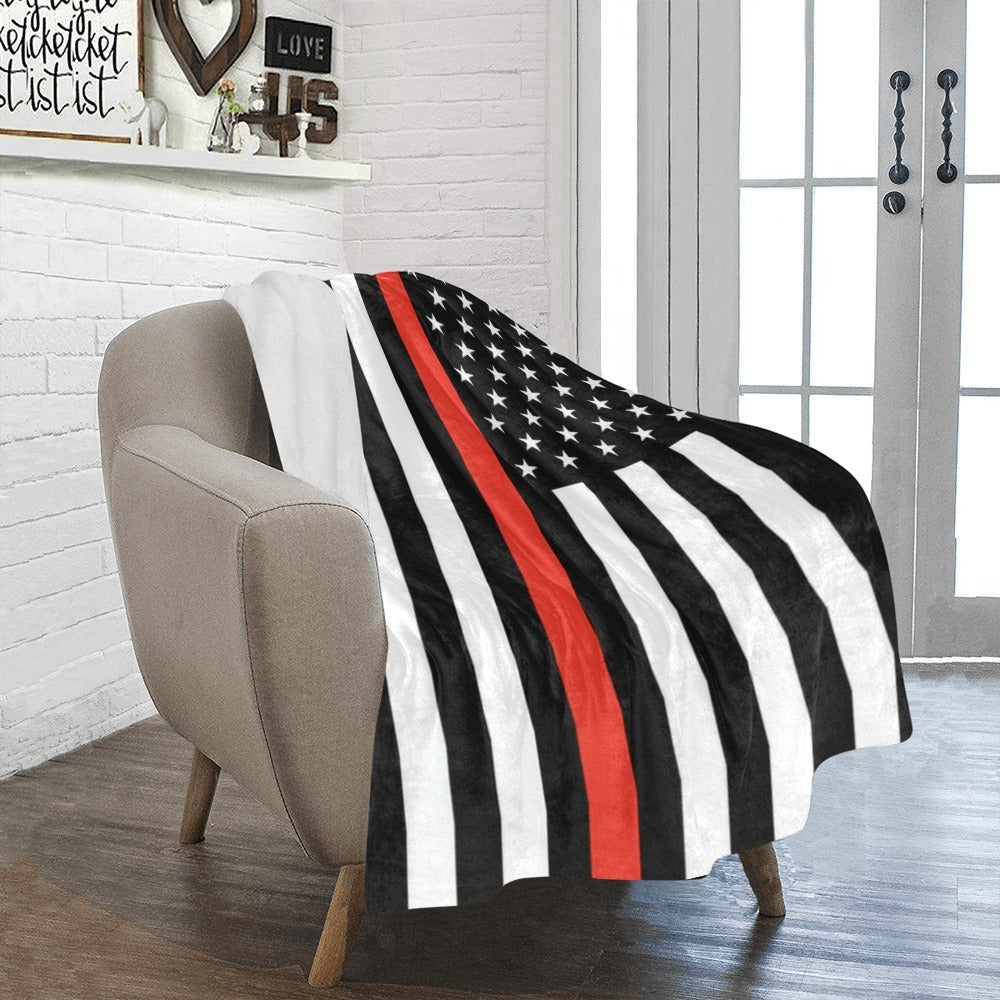 Cozy "Luv My Flag" blanket on cushy armchair, fireplace.