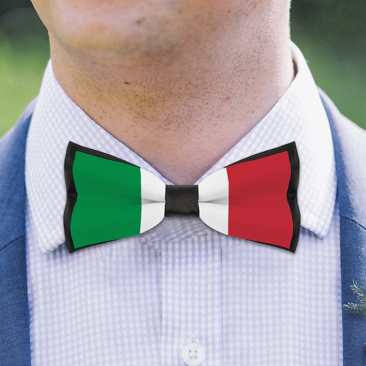 Man wearing [Brand] bow tie with Italian flag design.