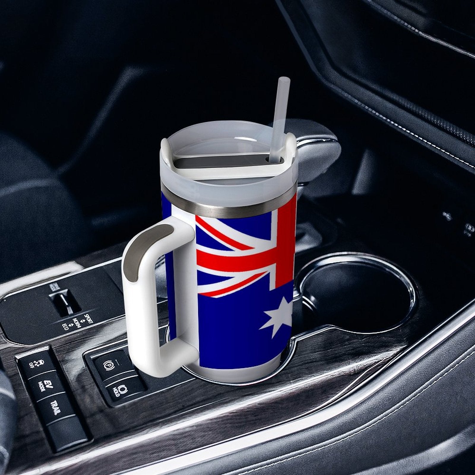 [Brand] travel mug in car, features Australia flag design.
