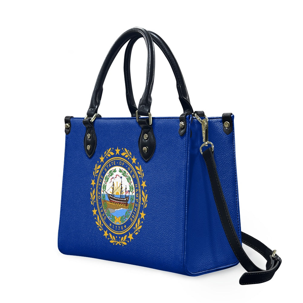 Blue handbag with black handles featuring [Brand] logo design.