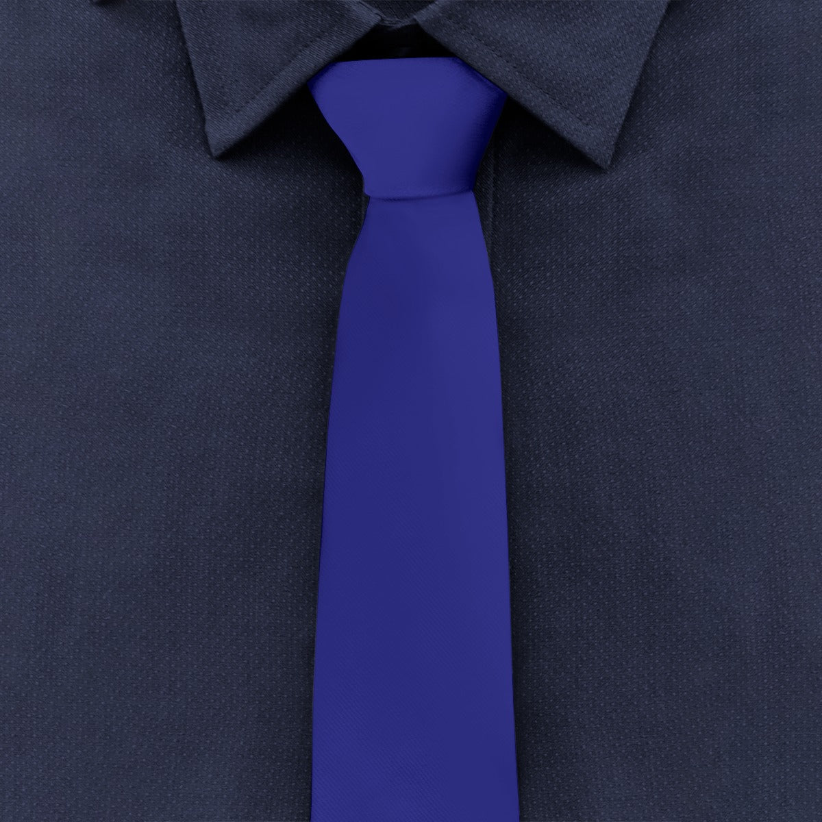 Blue tie with dark shirt from [Brand], close-up view.