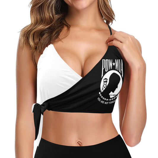 Woman wearing a black and white bikini with a 'DOW MIA' design on the black top.