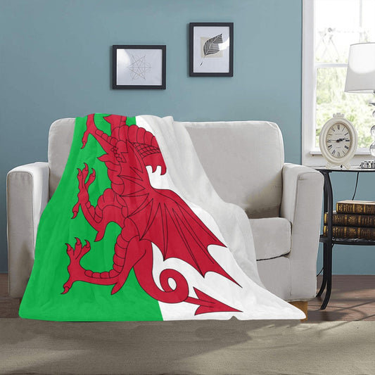 Luv My Flag blanket featuring Welsh dragon on couch.