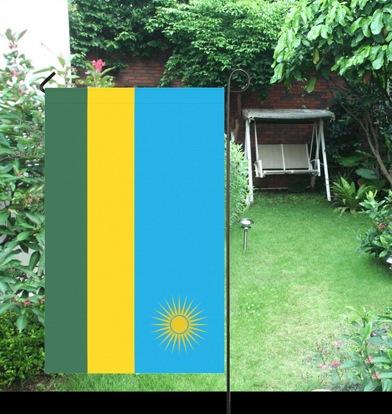 Luv My Flag garden flag in colorful, lush backyard setting.