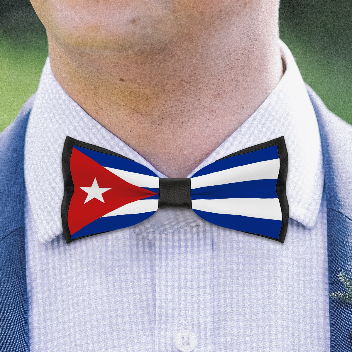 Man wearing bow tie featuring Cuban flag by [Brand].
