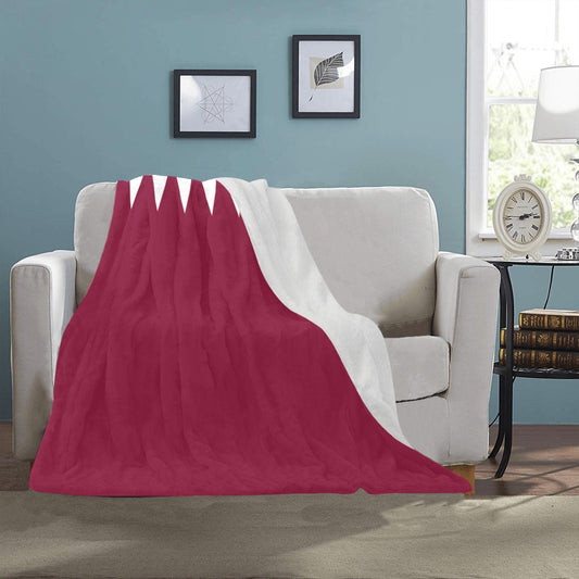 Cozy Luv My Flag blanket draped over a couch.