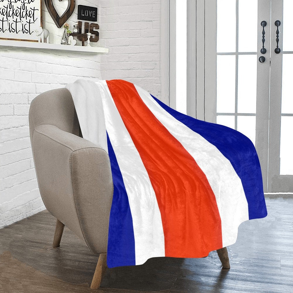 [Luv My Flag] throw blanket with vibrant stripes on chair.