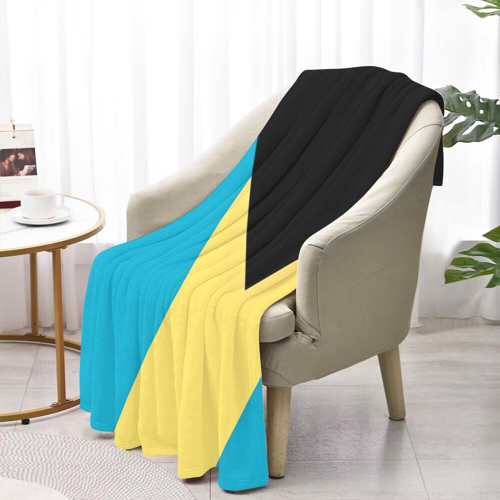 A Bahamas flag blanket by Luv My Flag on chair.