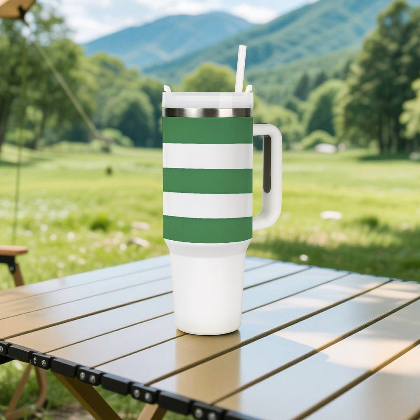 [Brand] mug with green stripes on outdoor table, mountains.