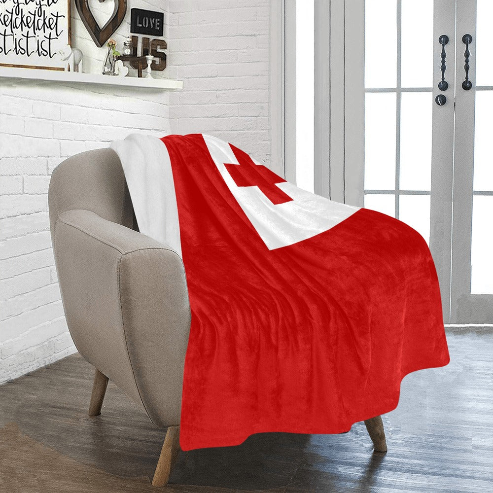 Cozy chair with Luv My Flag red-and-white blanket.