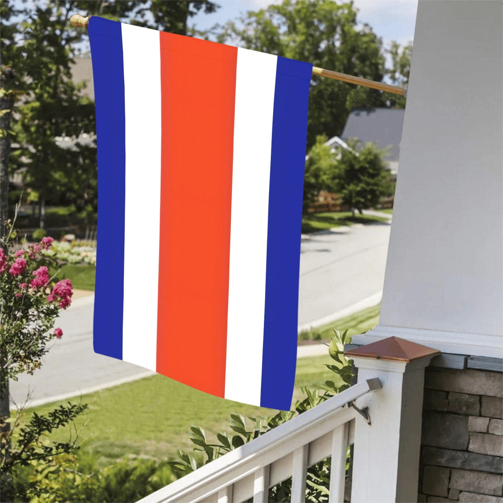 Luv My Flag tricolor flag displayed on porch railing.