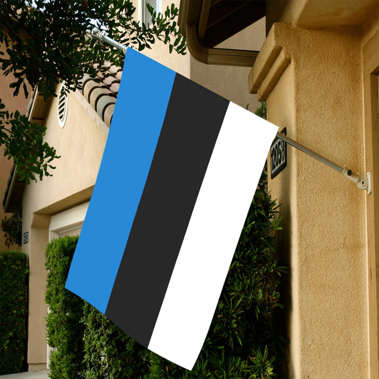 Luv My Flag: Estonian flag hangs outside beige house.