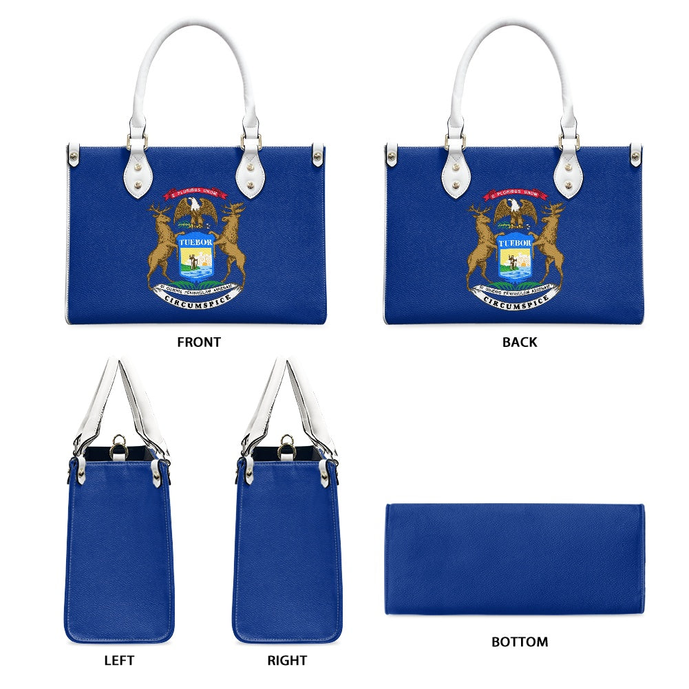 [Brand] blue handbag featuring Michigan state emblem, multiple views.