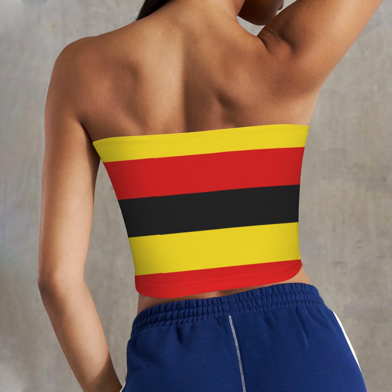 Back view of [Brand] striped tube top, blue shorts.