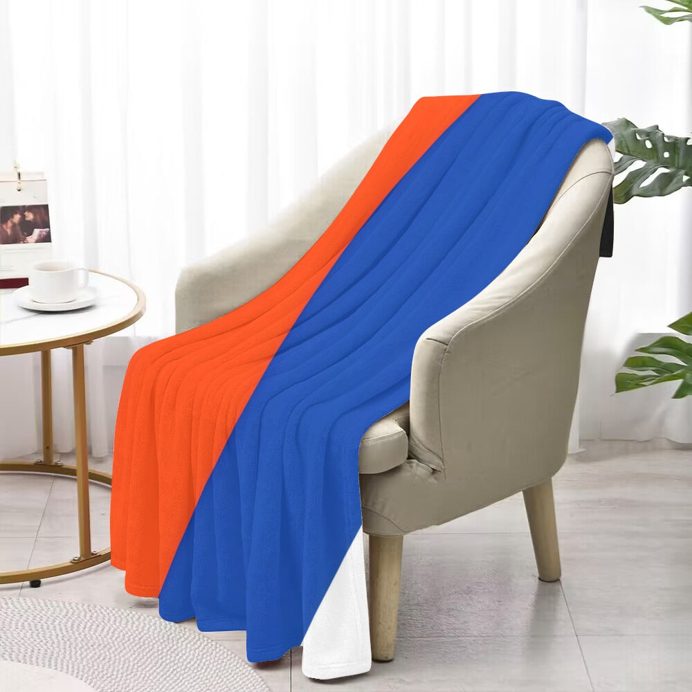 Luv My Flag blanket: bold orange and blue draped elegantly.
