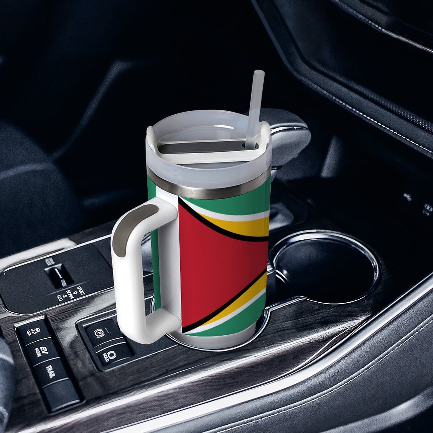 [Brand] colorful travel mug with straw in car cup holder.