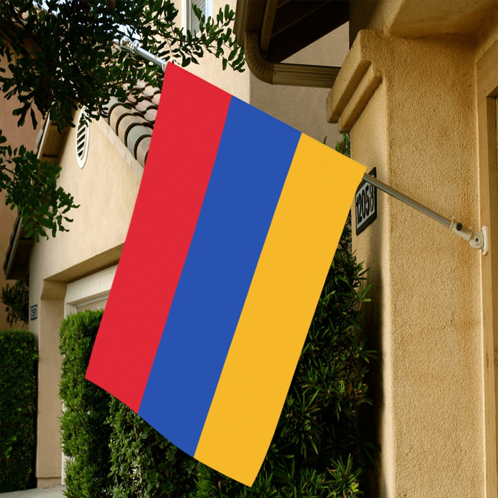Luv My Flag's red, blue, yellow flag displayed outside.