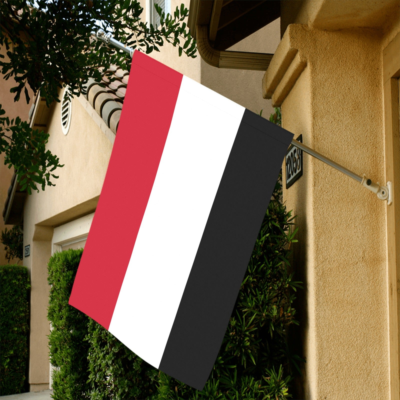 [Luv My Flag] red, white, black flag on house wall.