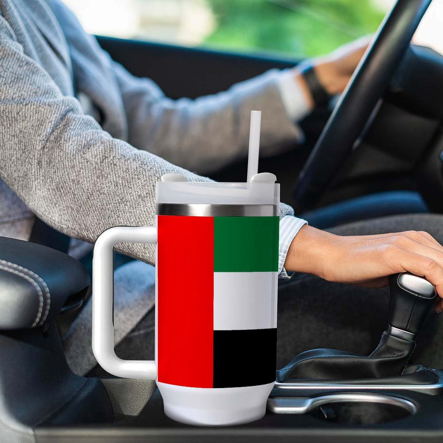[Brand] flask with UAE flag design in car holder.
