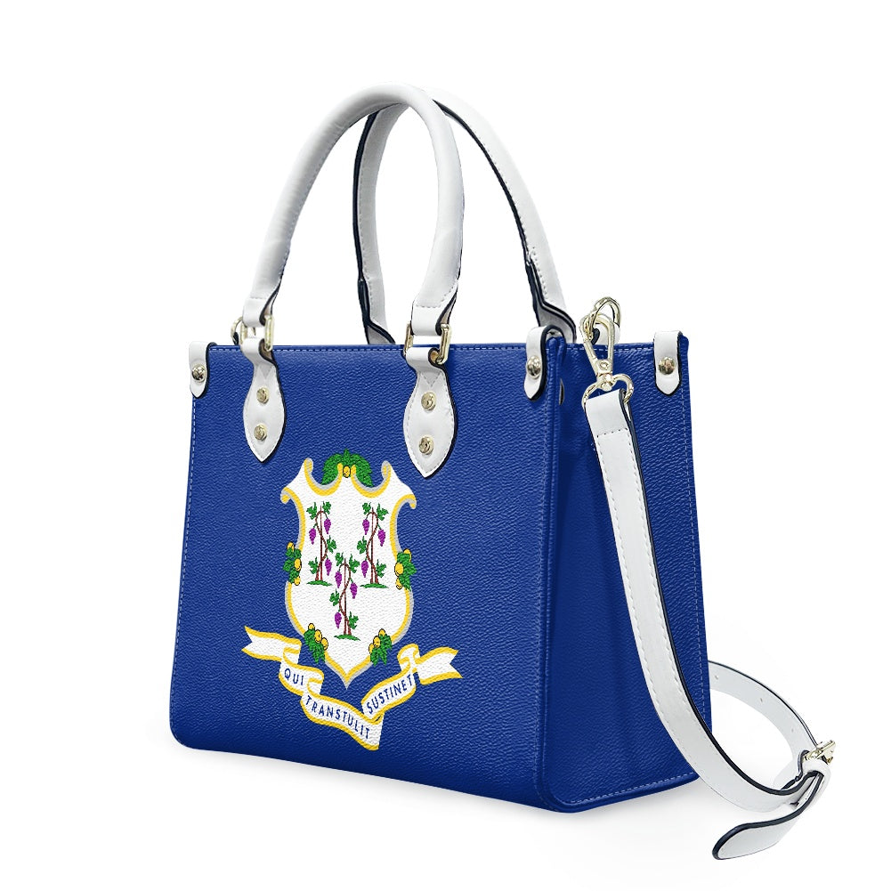 Blue [Brand] handbag featuring a colorful emblem and strap.