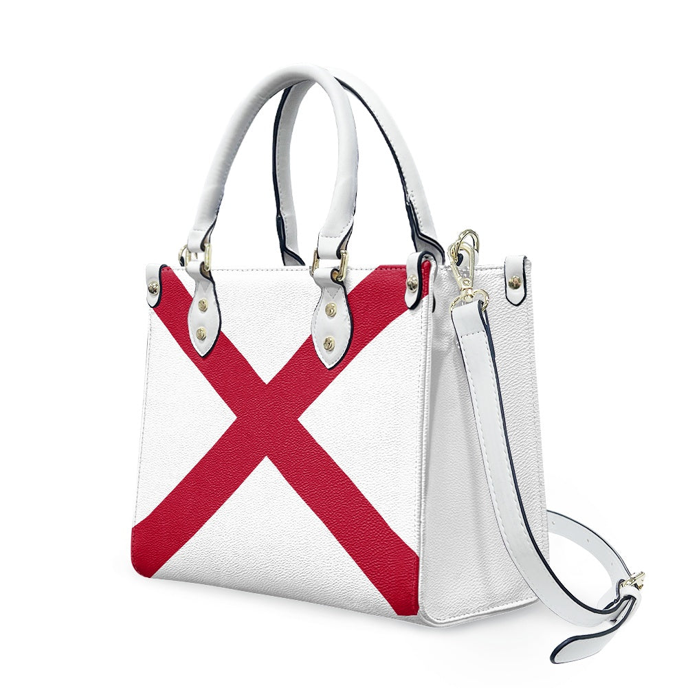 [Brand] handbag with red cross design, white background.