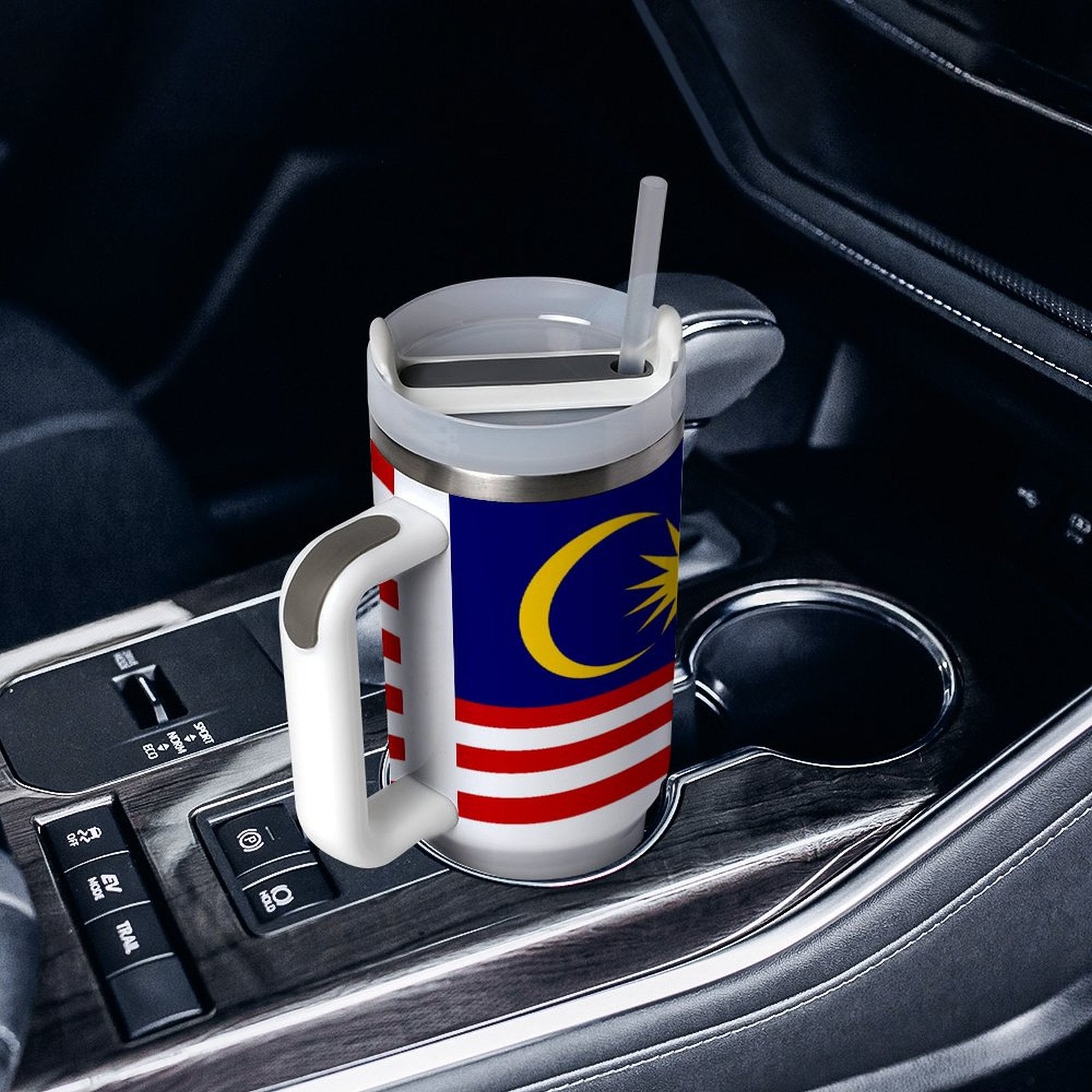 [Brand] mug with Malaysian flag in car cup holder.