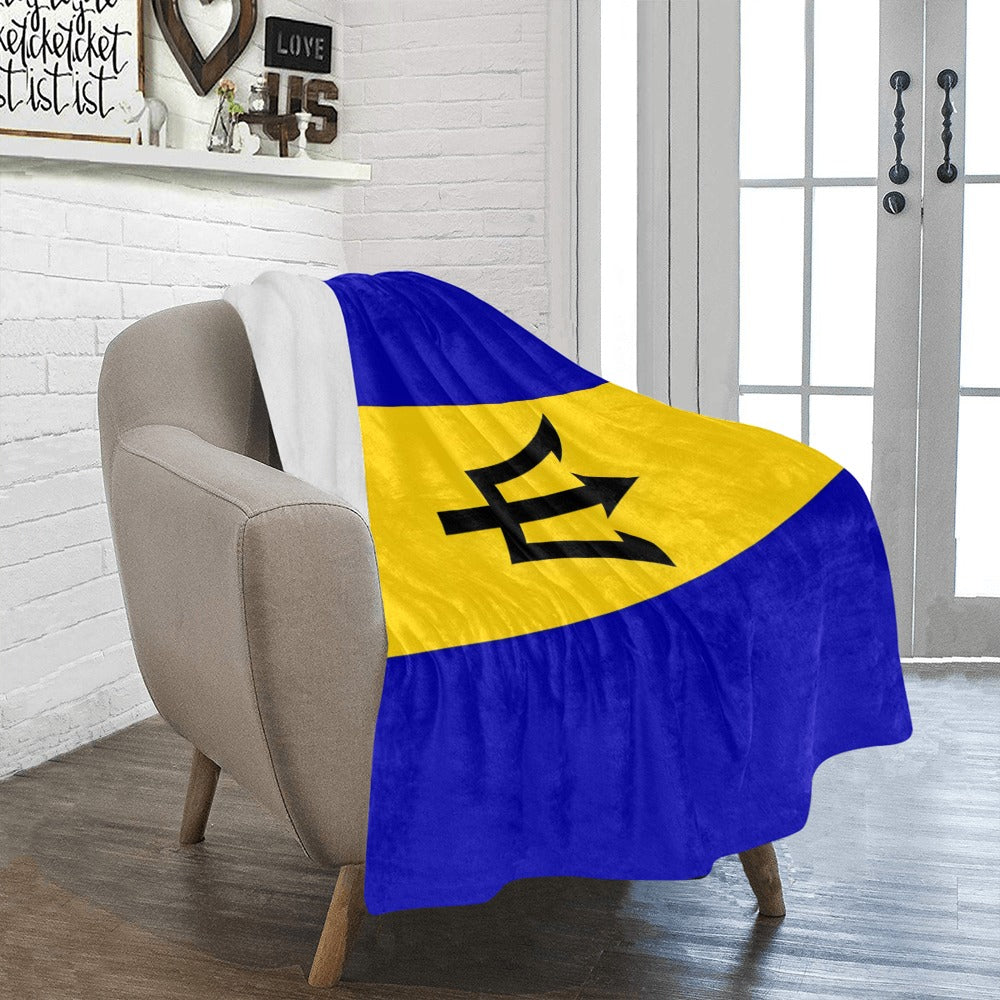 Cozy chair with Luv My Flag Barbados blanket draped.