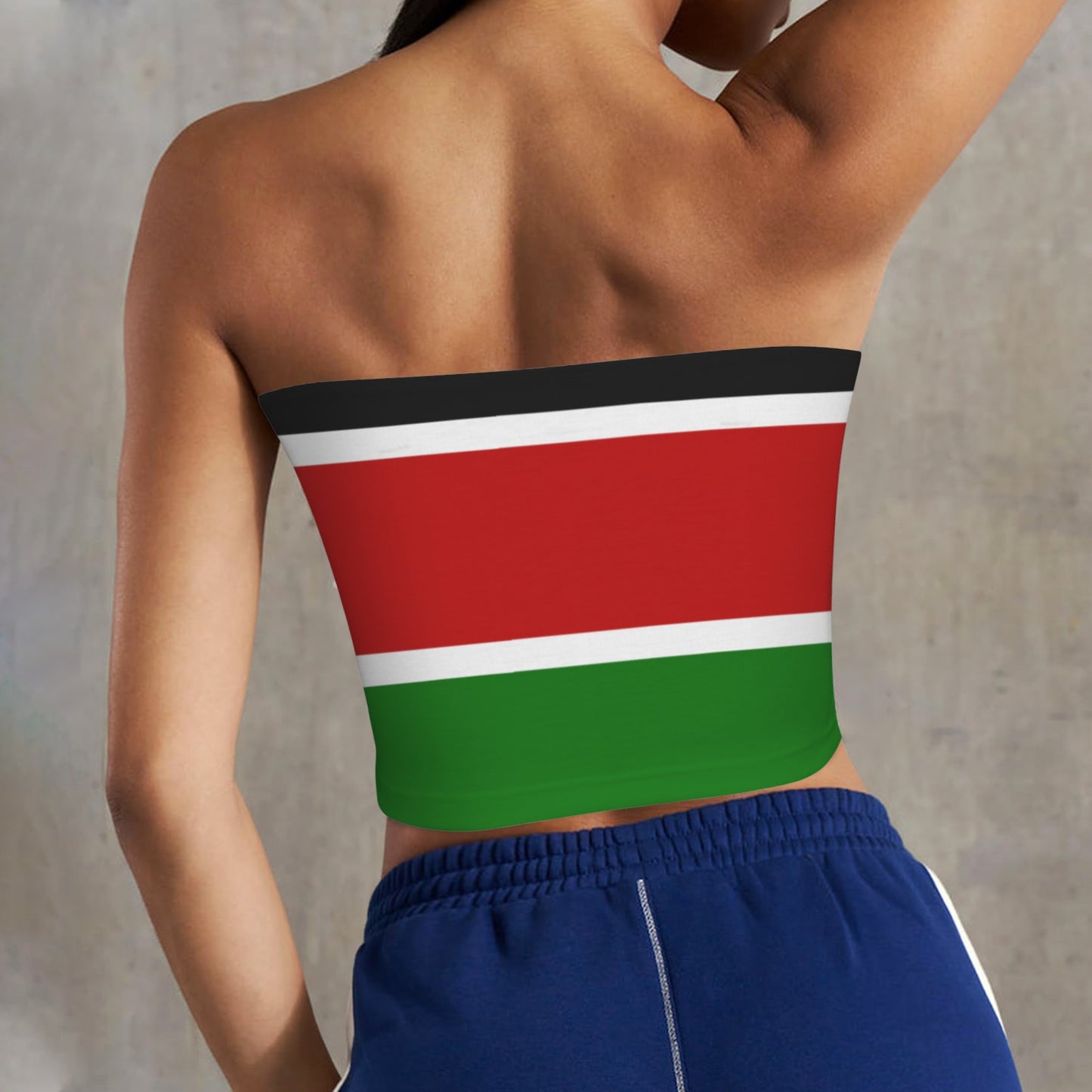 Back view of person wearing [Brand] Kenyan flag-inspired top.