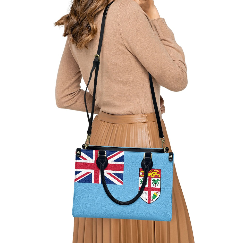 Woman carrying Luv My Flag Fiji-themed shoulder bag.