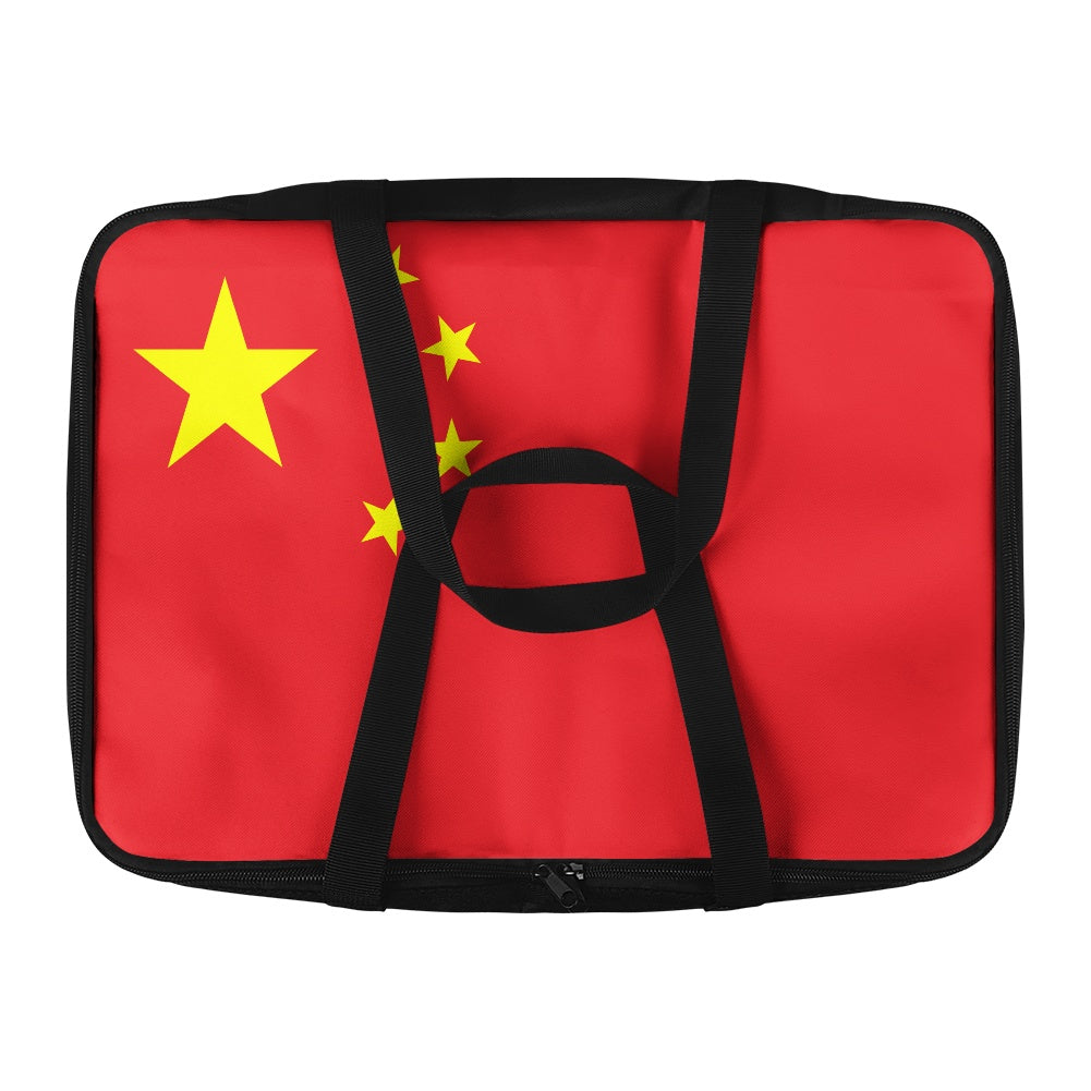 Red [Brand] bag featuring a design of yellow stars.