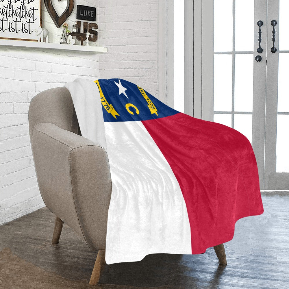 Cozy blanket featuring North Carolina flag by Luv My Flag.