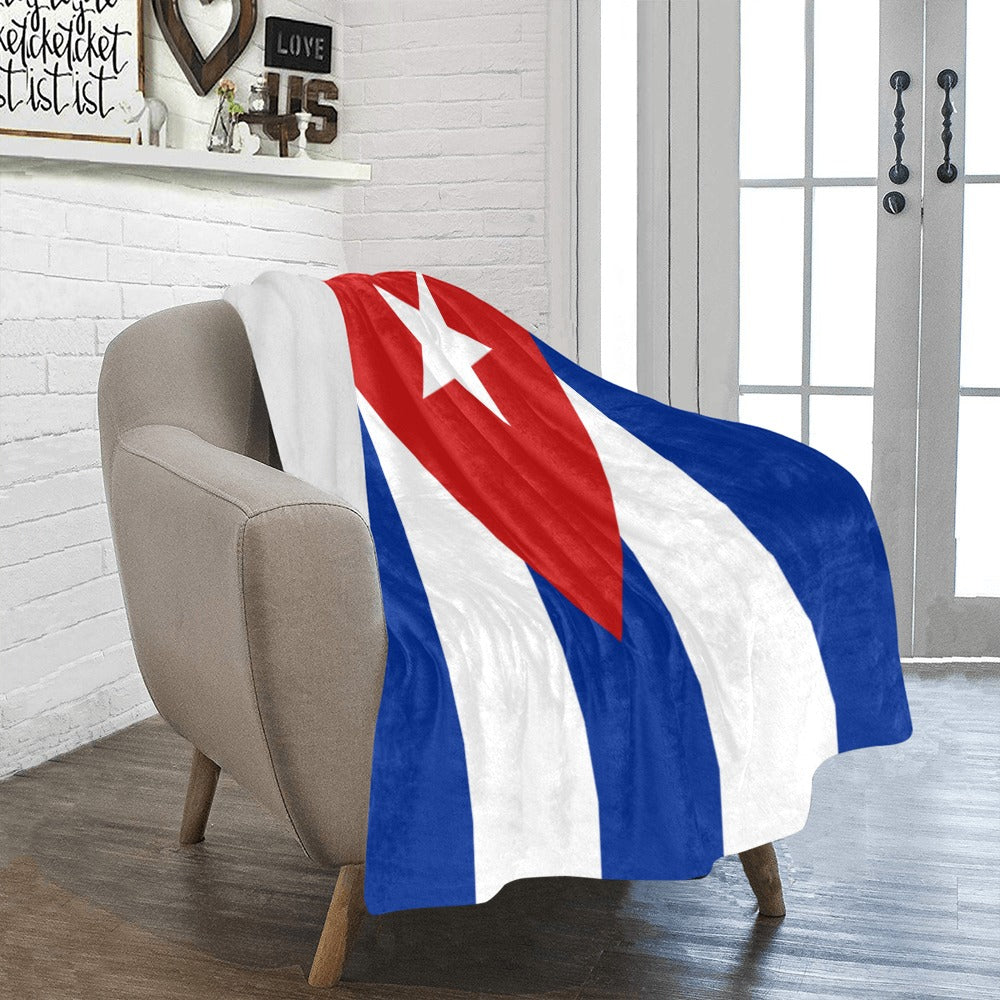 Cozy armchair with [Luv My Flag] Cuban flag blanket.
