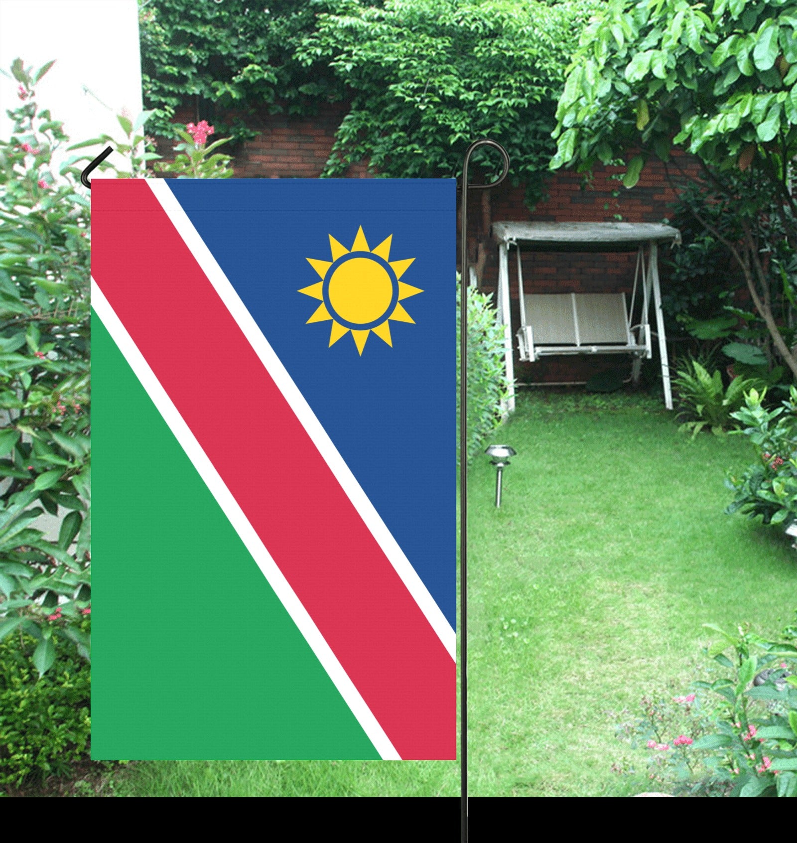 Garden scene with Luv My Flag Namibia flag displayed.