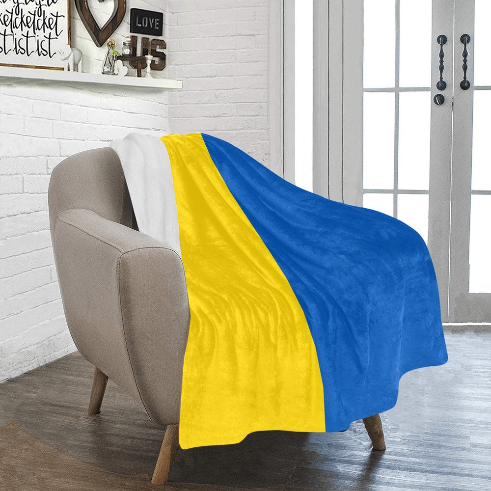 Cozy armchair with Luv My Flag Ukrainian-themed blanket.
