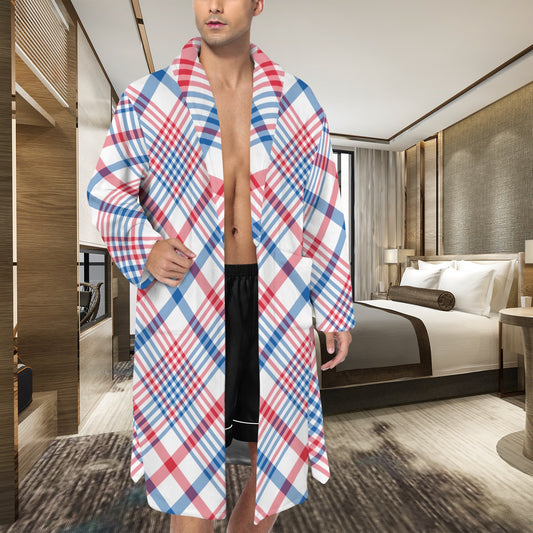 Man in plaid [Brand] robe and shorts in bedroom.