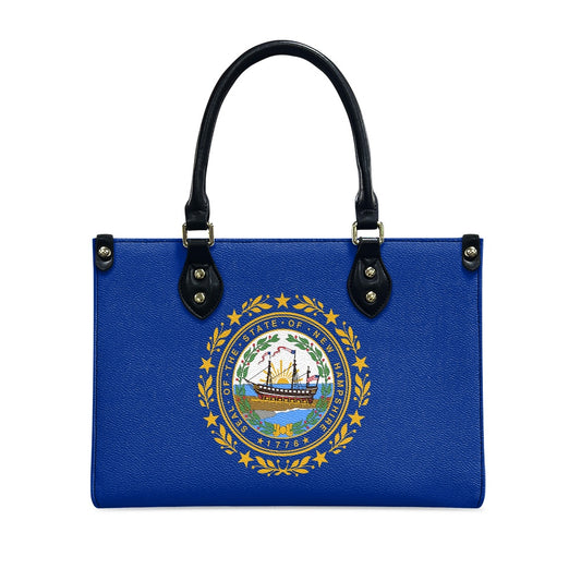 Blue handbag featuring New Hampshire seal, black handles, [Brand].