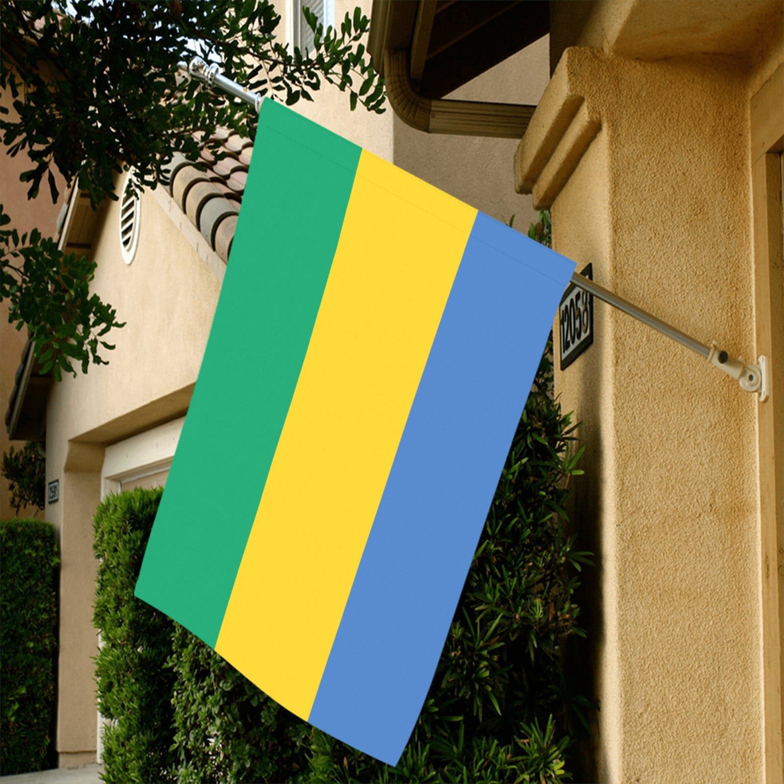 [Luv My Flag] Gabon flag displayed outside a tan house.