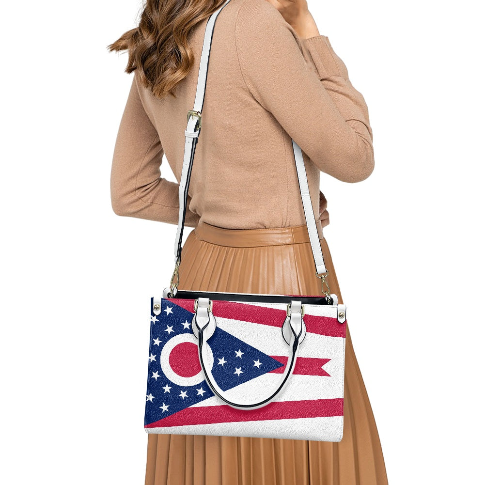 Woman carrying [Brand] bag with Ohio flag design.
