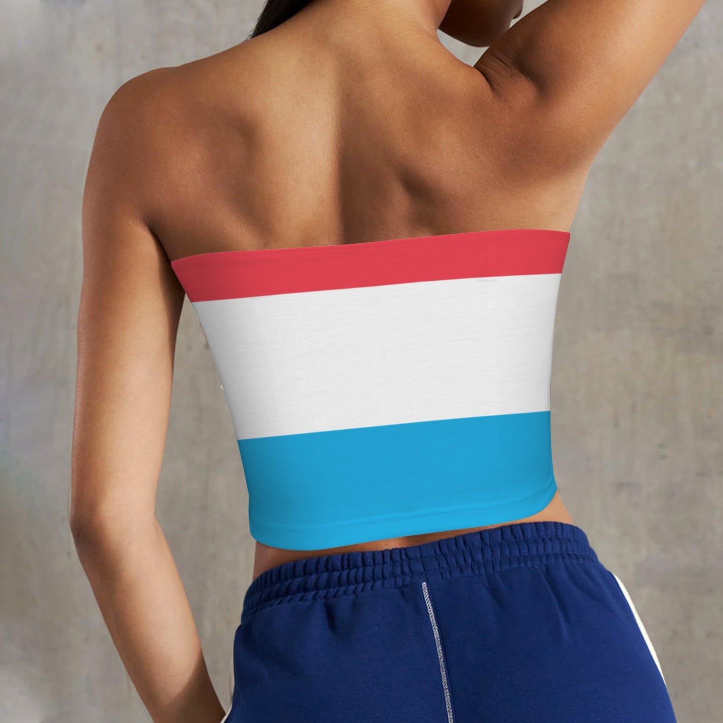 Back view wearing striped top, blue shorts, [Brand] design.