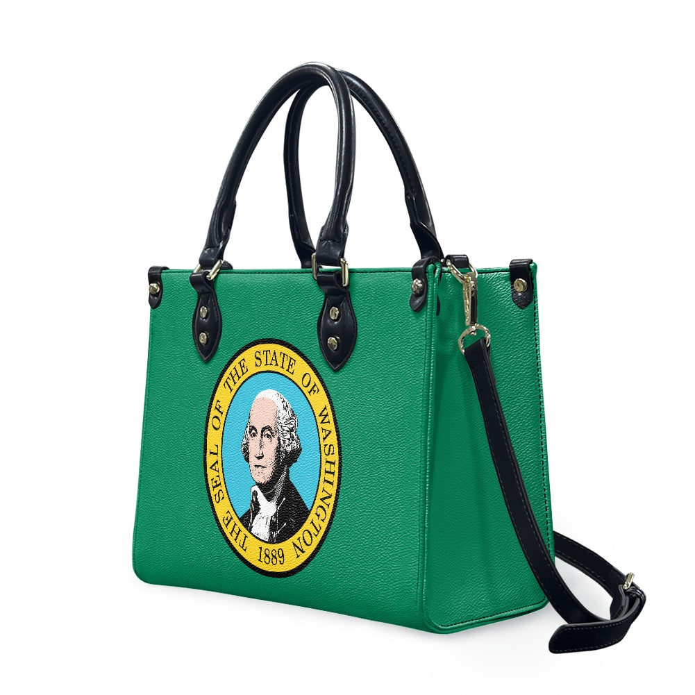 Green handbag featuring Washington state seal, black handles, [Brand].