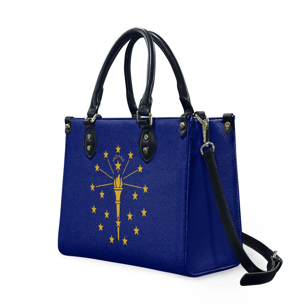 Blue [Brand] handbag with Indiana flag design, black straps.
