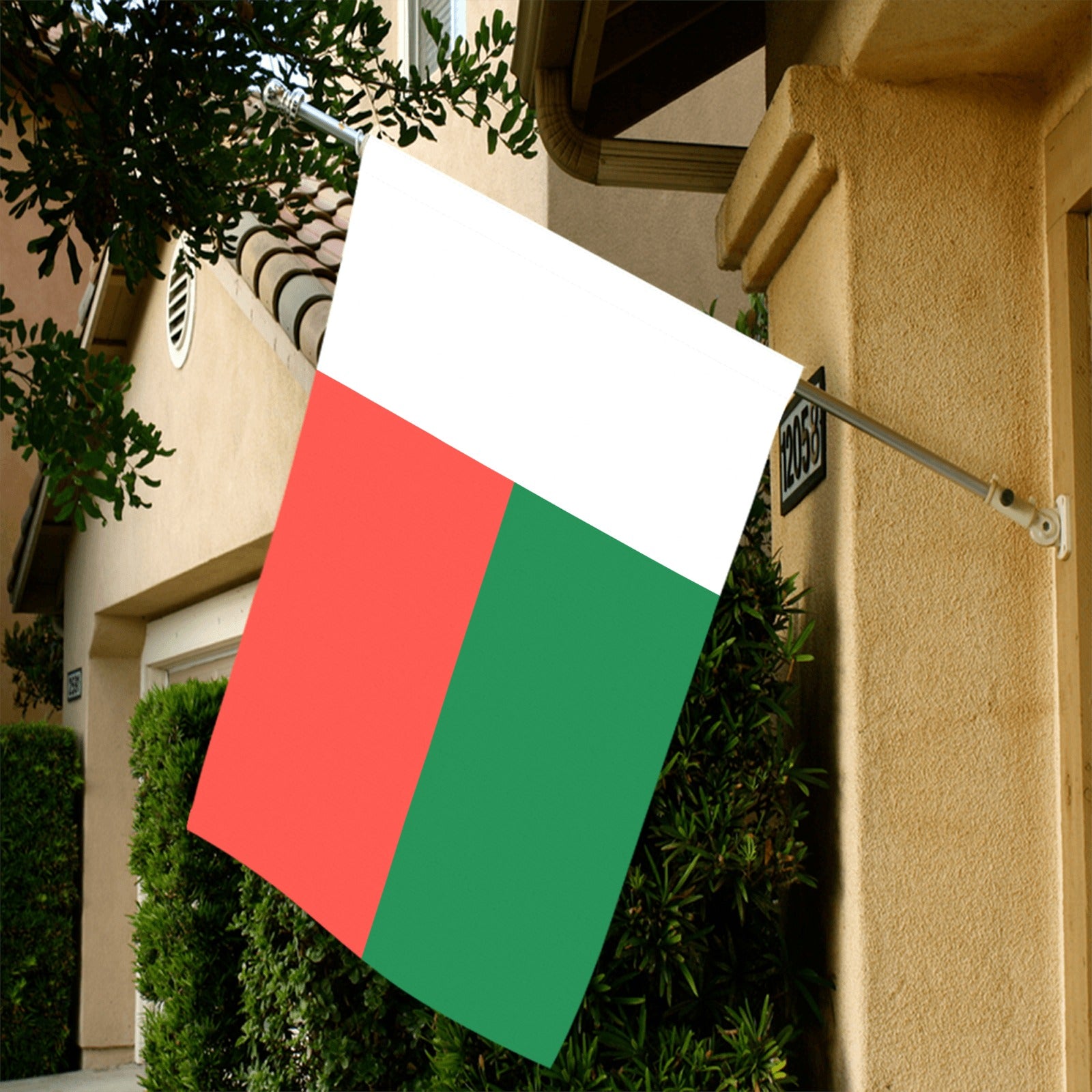 Luv My Flag displayed outside house in suburban neighborhood.