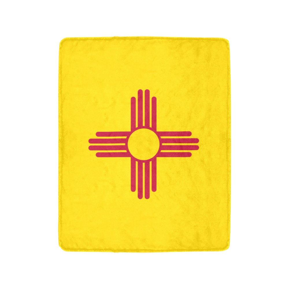 Yellow [Luv My Flag] blanket featuring a red Zia symbol.