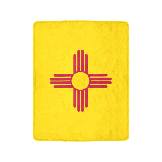 Yellow [Luv My Flag] blanket featuring a red Zia symbol.