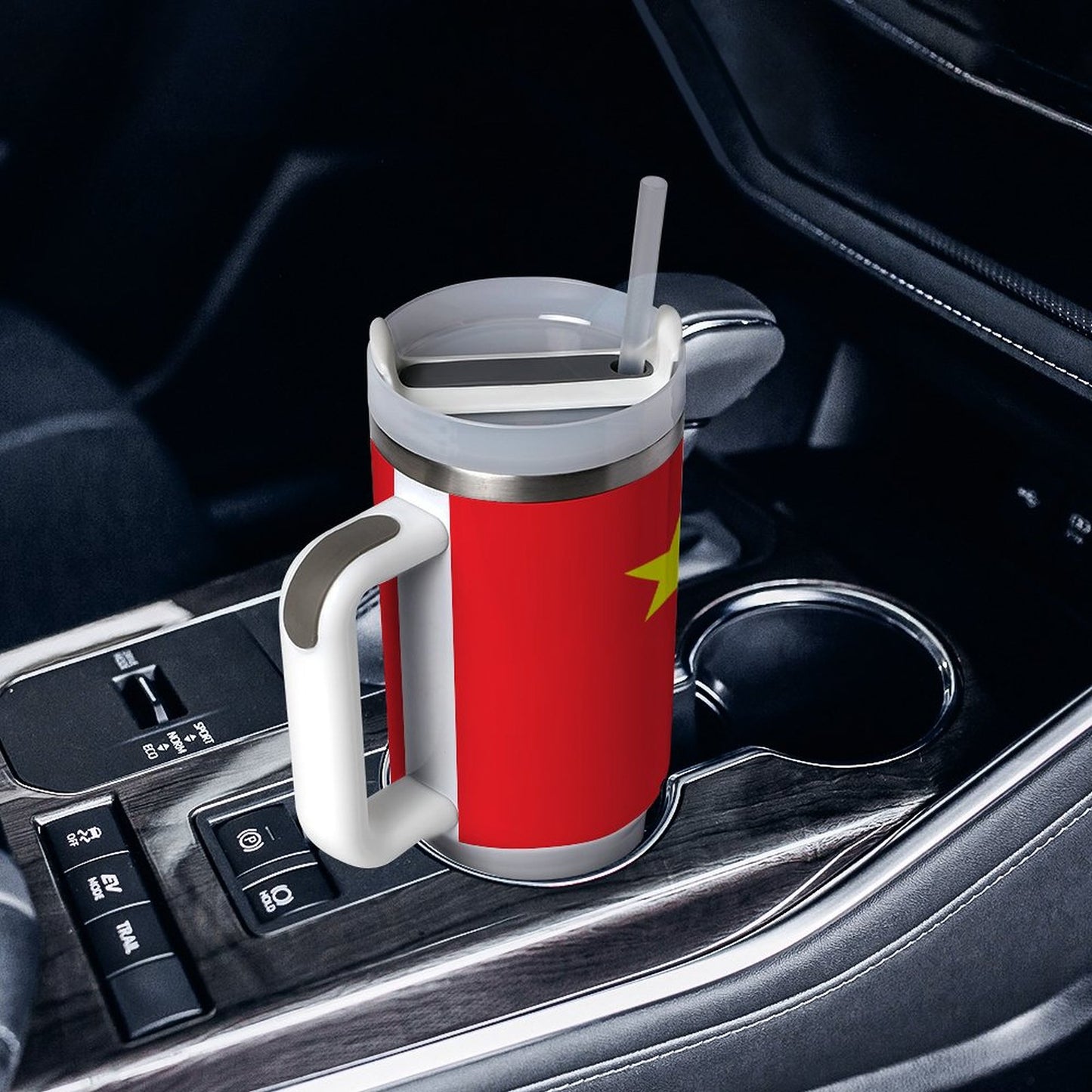[Brand] red travel mug in car cup holder with straw.
