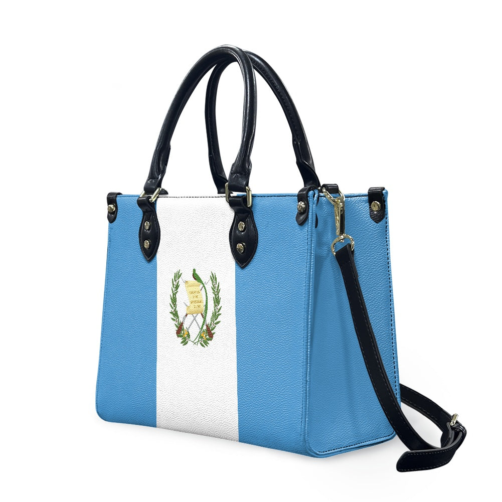 A [Brand] handbag featuring the Guatemalan flag design prominently.