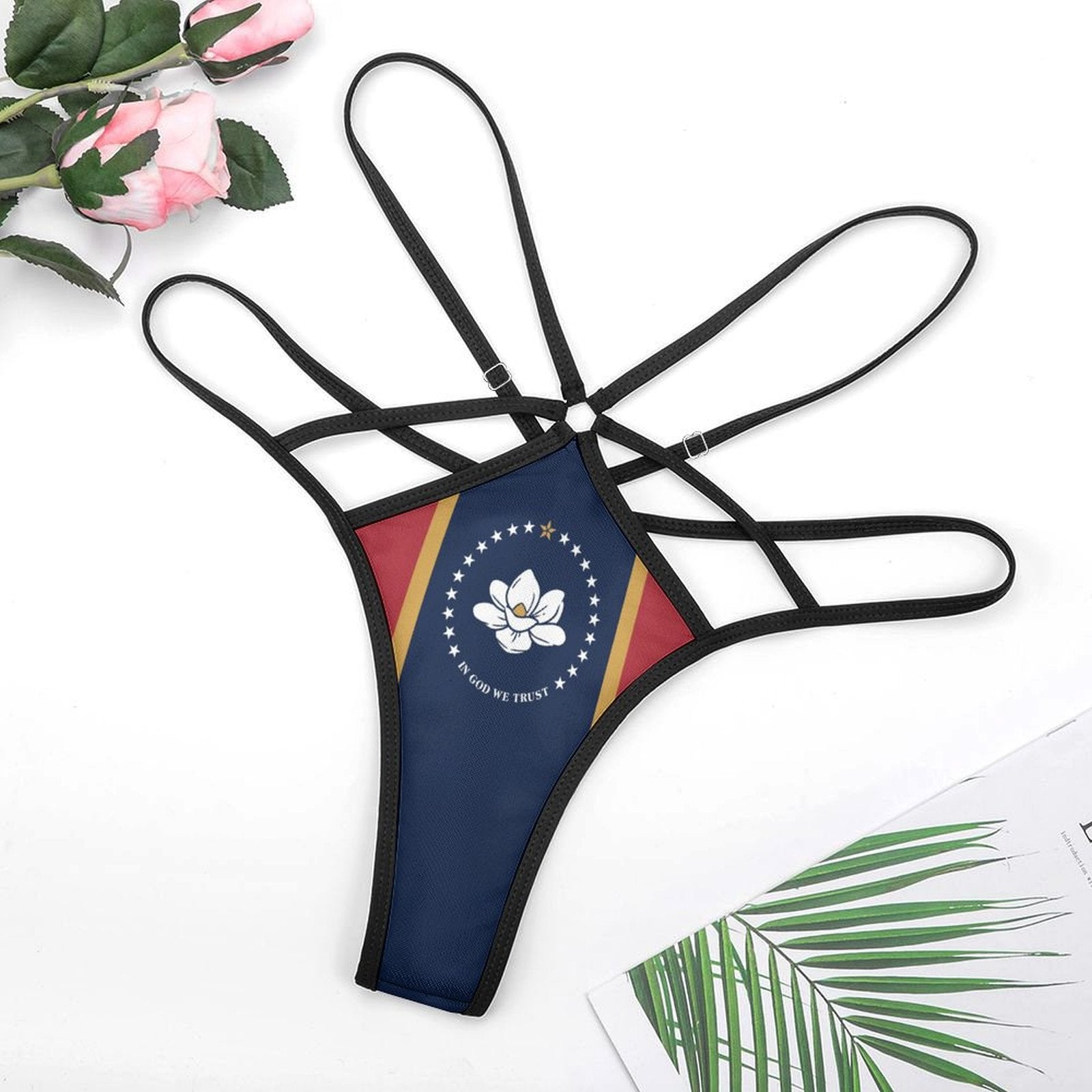 Unique strappy thong with [Brand] logo and floral design.