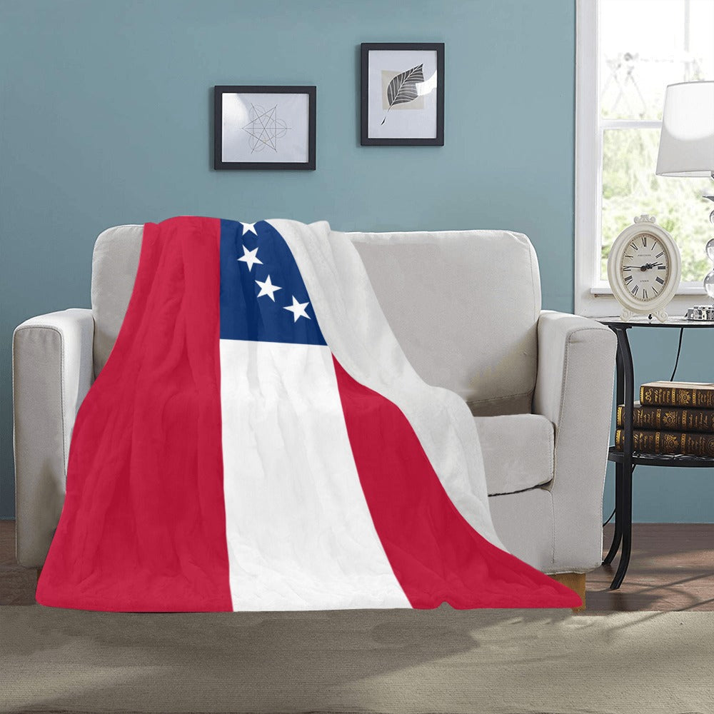 Red, white, blue [Luv My Flag] blanket on couch.