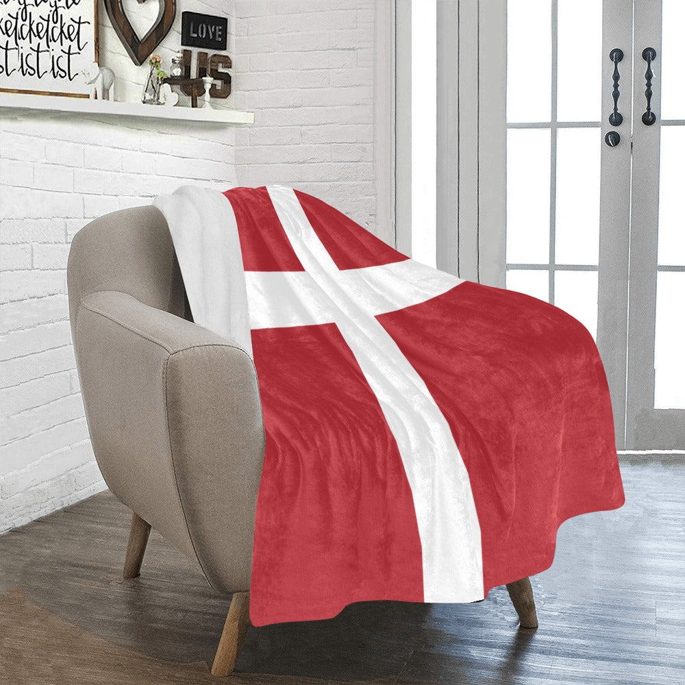 Red and white blanket on chair in cozy room. [Luv My Flag]